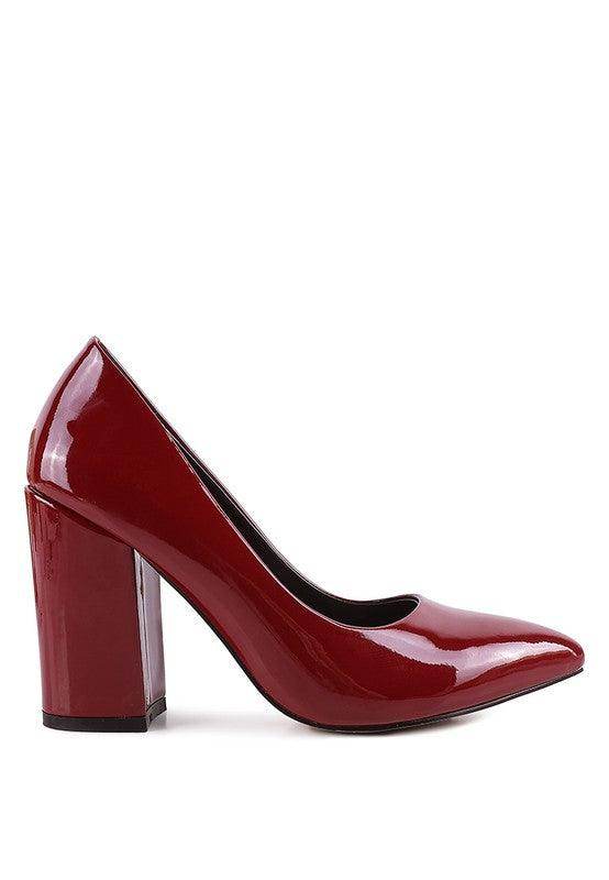 Stylish red heels with a glossy finish, perfect for pairing with elegant black pumps for women