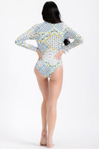 Women's long sleeve swimsuit in patterned fabric, perfect for sunny beach days