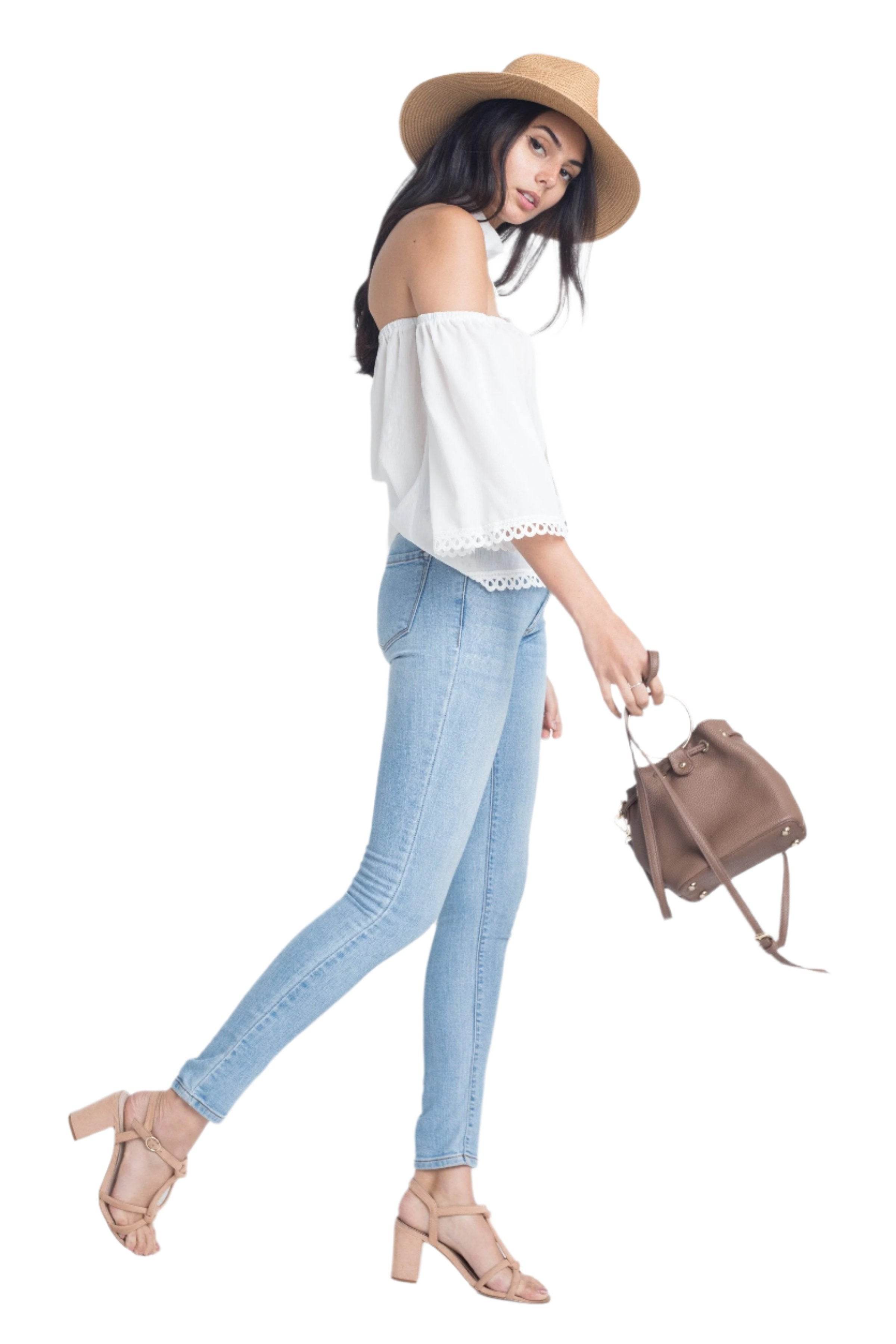 Ivory Felix long sleeve vacation top styled with light blue jeans and a sun hat
