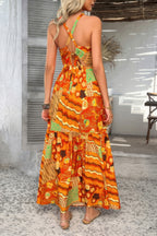 Women's long sleeveless dress in vibrant orange floral print, perfect for summer occasions
