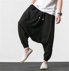 Loose fit mens vacation pants in black, featuring an elastic waistband and casual style for comfortable wear