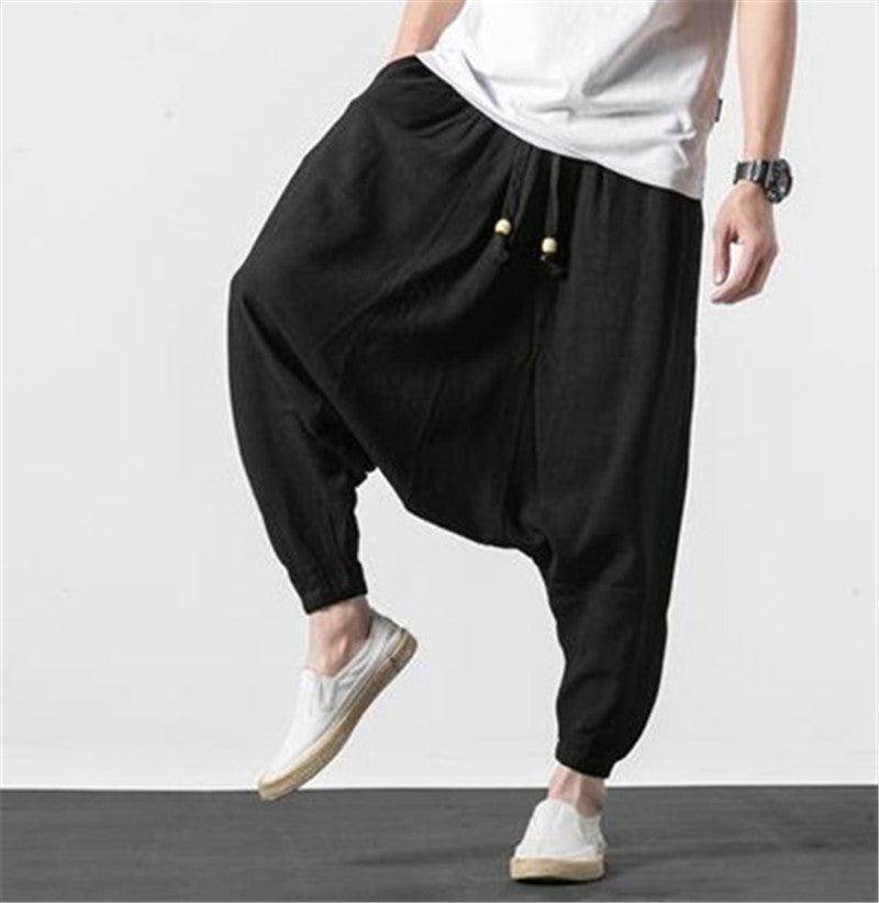 Loose fit mens vacation pants in black, featuring an elastic waistband and casual style for comfortable wear