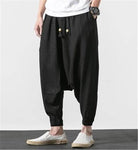 Comfortable loose fit mens vacation pants in black with drawstring waist and tapered cuffs