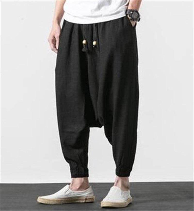 Comfortable loose fit mens vacation pants in black with drawstring waist and tapered cuffs
