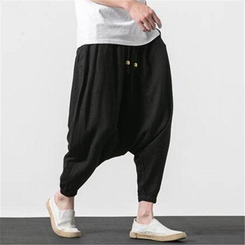 Comfortable loose fit mens vacation pants in black with elastic cuffs and stylish design for summer outings
