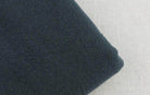 Soft fabric texture of loose fit men's vacation pants by VacationGrabs in dark color