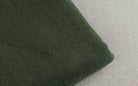 Soft green fabric close-up of loose fit mens vacation pants by VacationGrabs for ultimate comfort