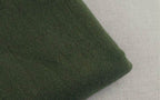 Soft green fabric close-up of loose fit mens vacation pants by VacationGrabs for ultimate comfort