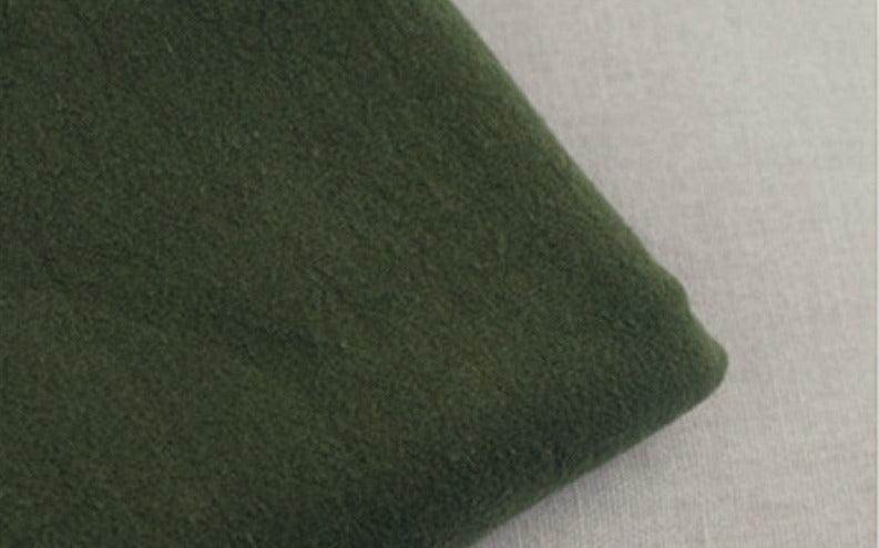 Soft green fabric close-up of loose fit mens vacation pants by VacationGrabs for ultimate comfort