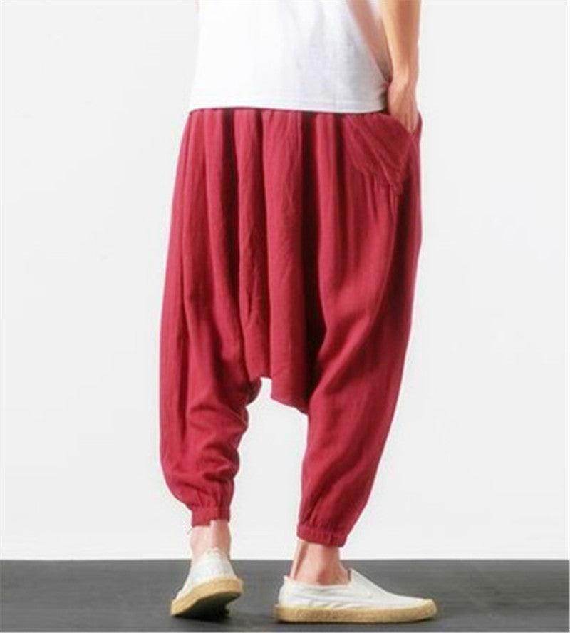 Loose fit men's vacation pants in red with comfortable pockets and elastic cuffs for stylish relaxation