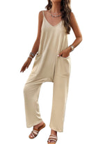 Loose sleeveless jumpsuit for women in light beige with side pockets and relaxed fit