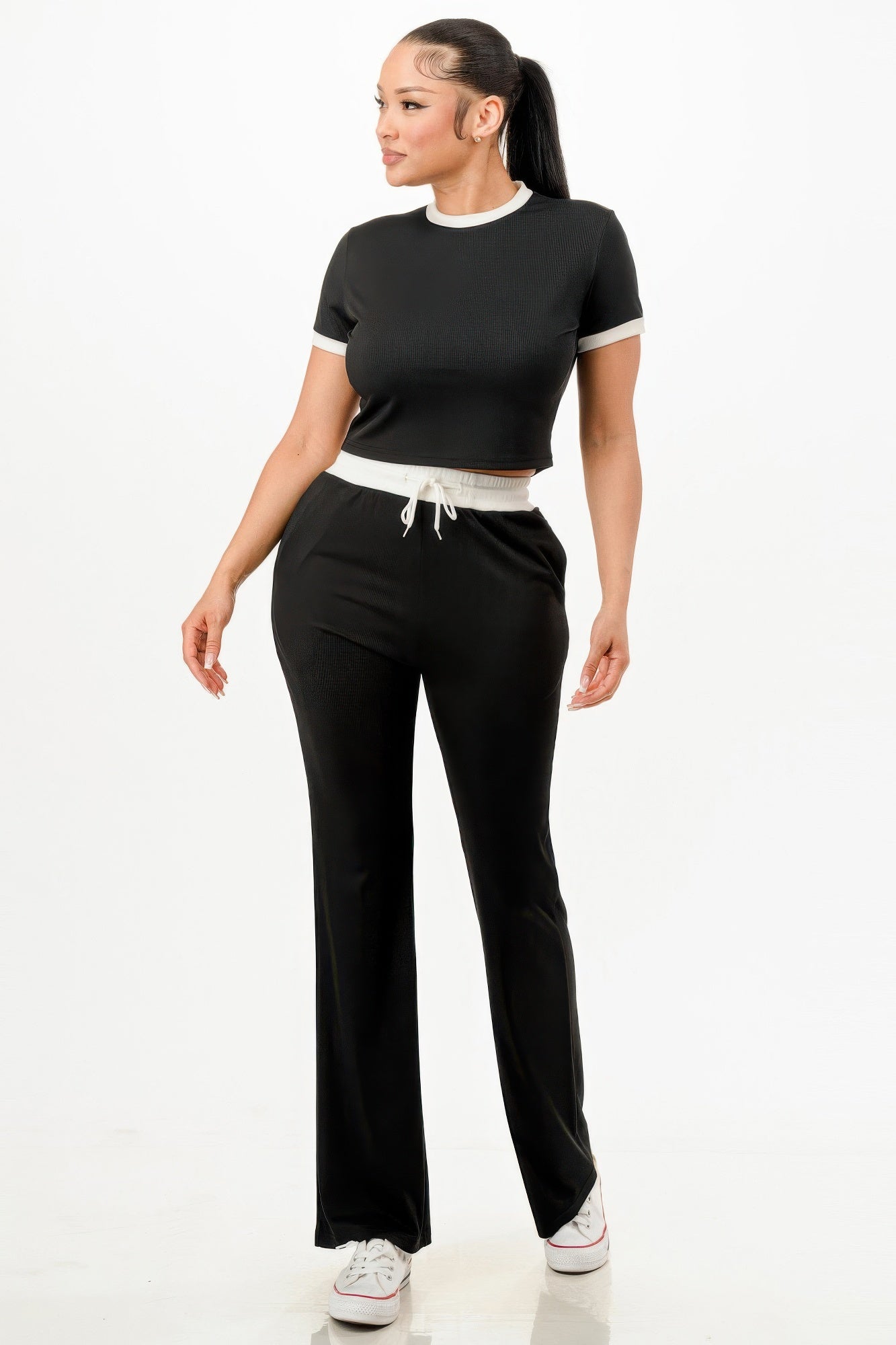 Stylish women's ribbed contrast binding lounge set in black with a cropped top and relaxed pants