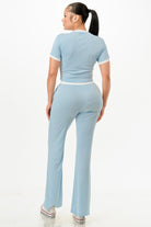 Women's ribbed contrast binding lounge set in light blue with fitted top and flared pants