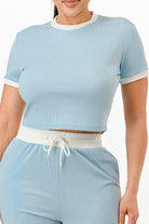Light blue ribbed contrast binding lounge set featuring a cropped top and matching drawstring shorts.
