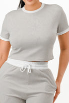 Women's ribbed contrast binding lounge set in light gray with comfortable crop top and shorts design