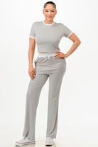 Women's ribbed contrast binding lounge set in gray with a cropped top and relaxed pants for comfort