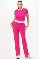 Pink Women's ribbed contrast binding lounge set with a cropped top and matching pants