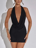 Black low-cut evening dress for women with halter neck and draped front design by VacationGrabs