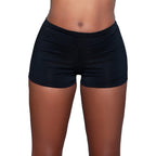 BE WICKED seamless butt enhancer shorts in black mid rise smooth fabric front view on model