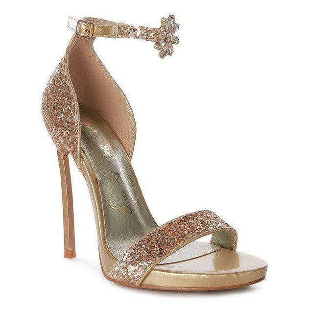 Elegant gold and pink sequined women's high heels with a floral ankle strap, perfect for formal events.