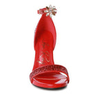 Elegant red high heels with sparkling details and ankle strap, showcasing luxury black high heels style
