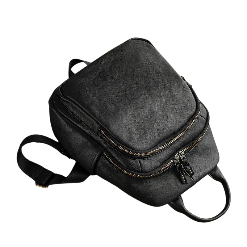 Black backpack with a small black object on a white background