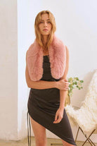 Bella Chic luxury faux fur fashion scarf in soft pink worn with a sleek black dress