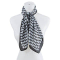 Bella Chic luxury vacation scarf in black and white pattern, perfect accessory for stylish travel