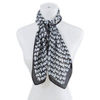 Bella Chic luxury vacation scarf in black and white pattern, perfect accessory for stylish travel