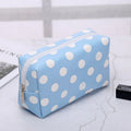 Blue polka dot makeup bag for organizing cosmetics and beauty items