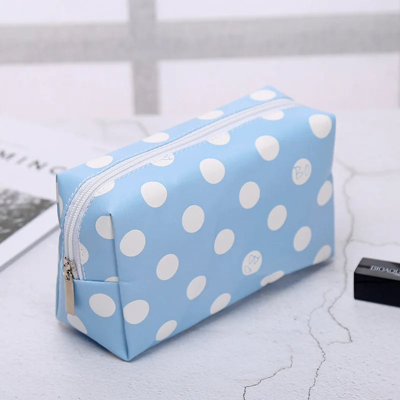 Blue polka dot makeup bag for organizing cosmetics and beauty items