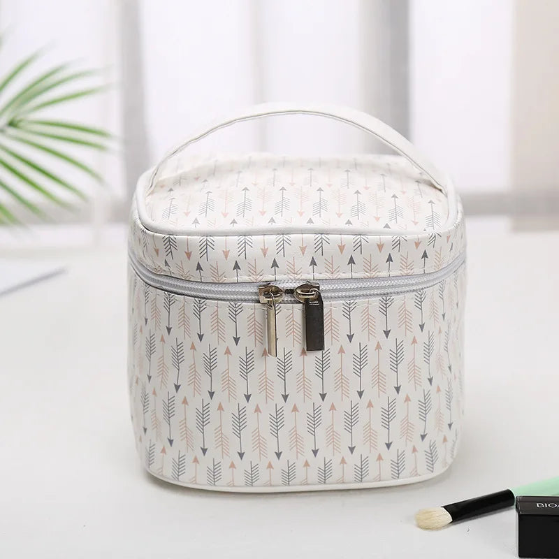 Stylish white makeup bag cosmetic with arrow pattern for organizing beauty products