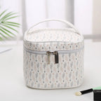 Stylish white makeup bag cosmetic with arrow pattern for organizing beauty products