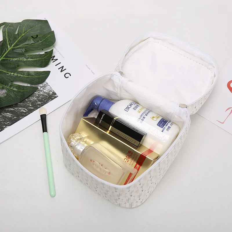 White makeup bag cosmetic for storing beauty products and toiletries