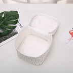 White fabric makeup bag cosmetic with spacious interior for travel organization