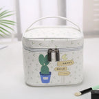 White cosmetic makeup bag with cactus design for travel organization