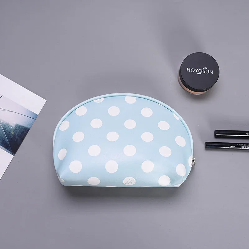 Light blue polka dot makeup bag for organizing cosmetics