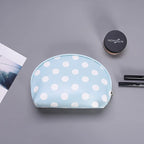 Light blue polka dot makeup bag, perfect for organizing cosmetics
