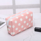 Pink polka dot makeup bag for storing cosmetics and beauty essentials