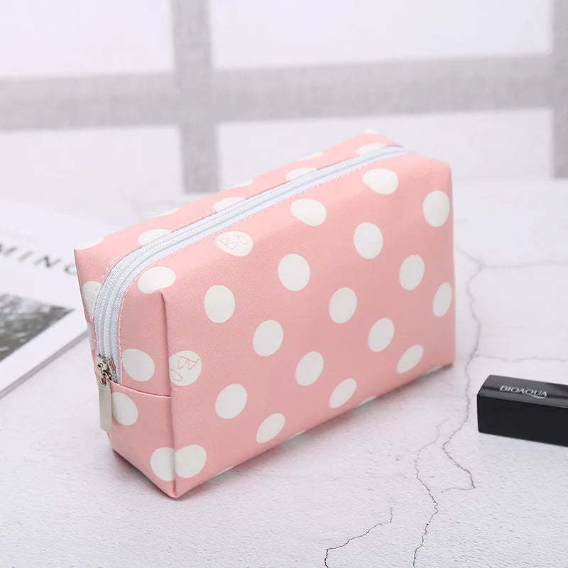 Pink polka dot makeup bag for storing cosmetics and beauty essentials