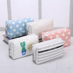 Colorful makeup bag set with cactus and polka dot designs for organizing cosmetics