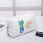 White makeup bag with cactus print, perfect for travel and organization