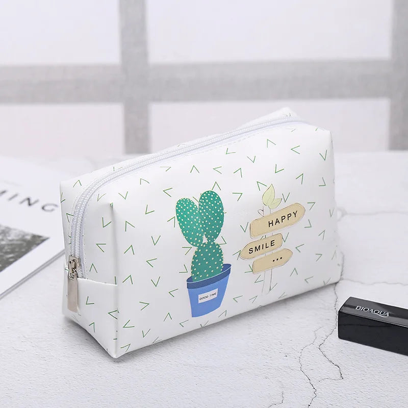 White makeup bag with cactus print, perfect for travel and organization