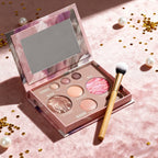 VacationGrabs makeup palettes with marbled powders and a makeup brush