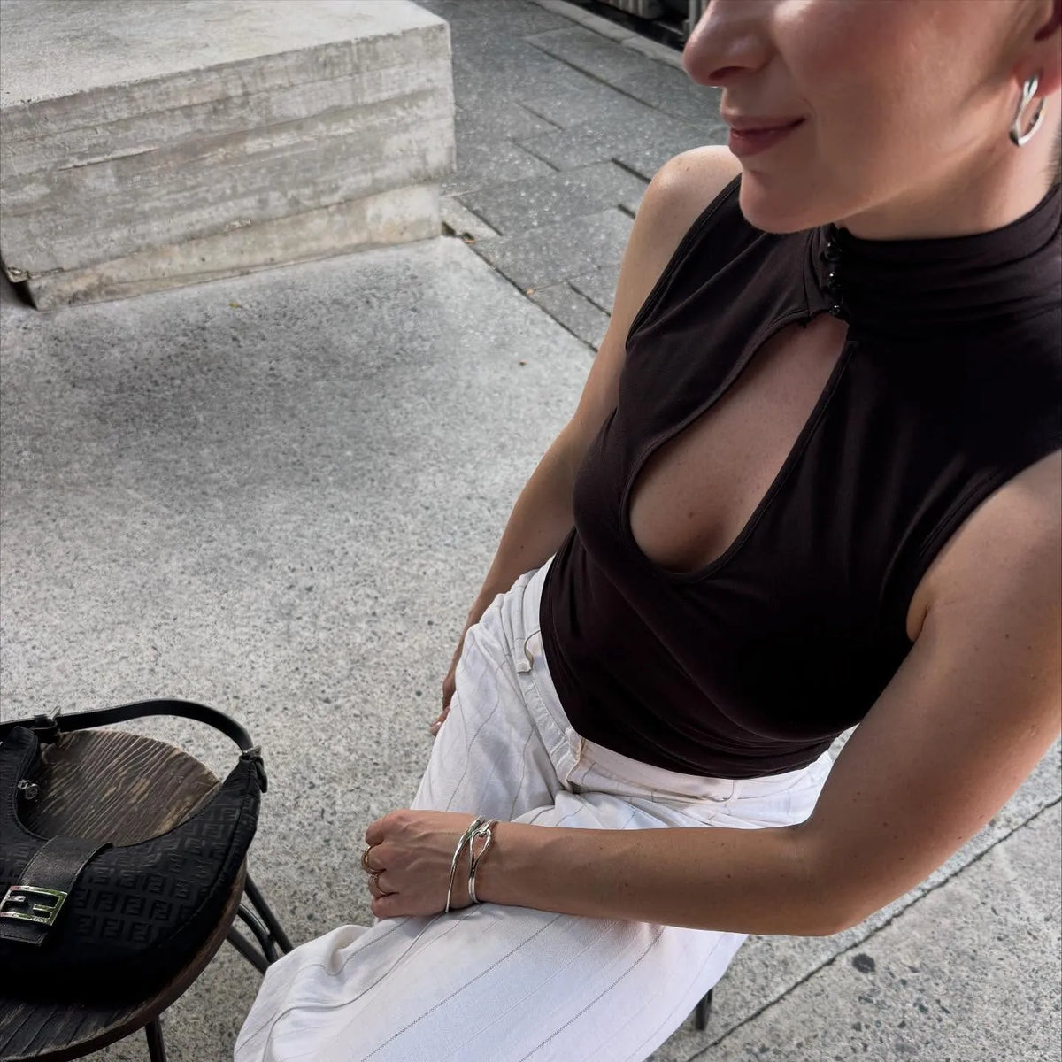 Women's black sleeveless top with mandarin collar for stylish outings