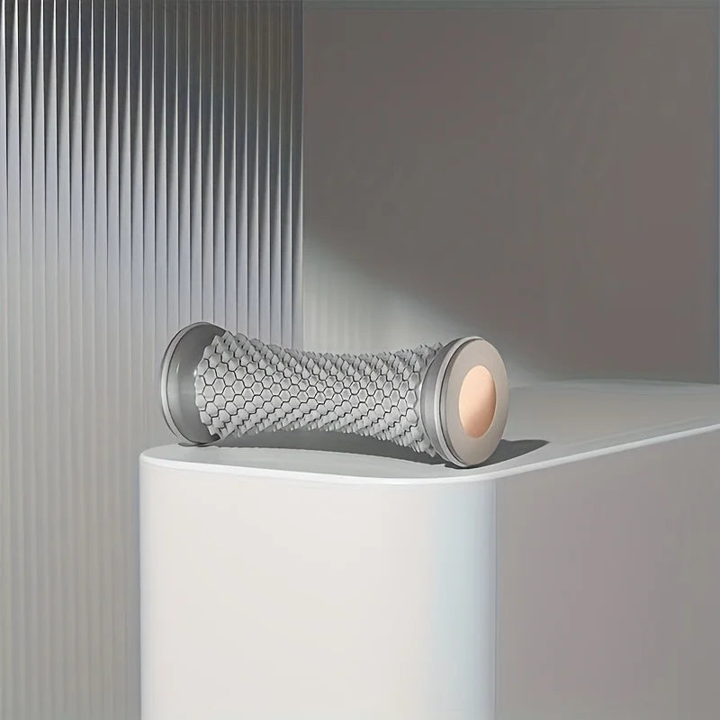 Manual foot massager roller in grey for relaxing foot therapy