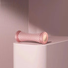 Pink manual foot massager roller for relaxation and pain relief