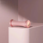 Pink manual foot massager roller for relaxation and pain relief