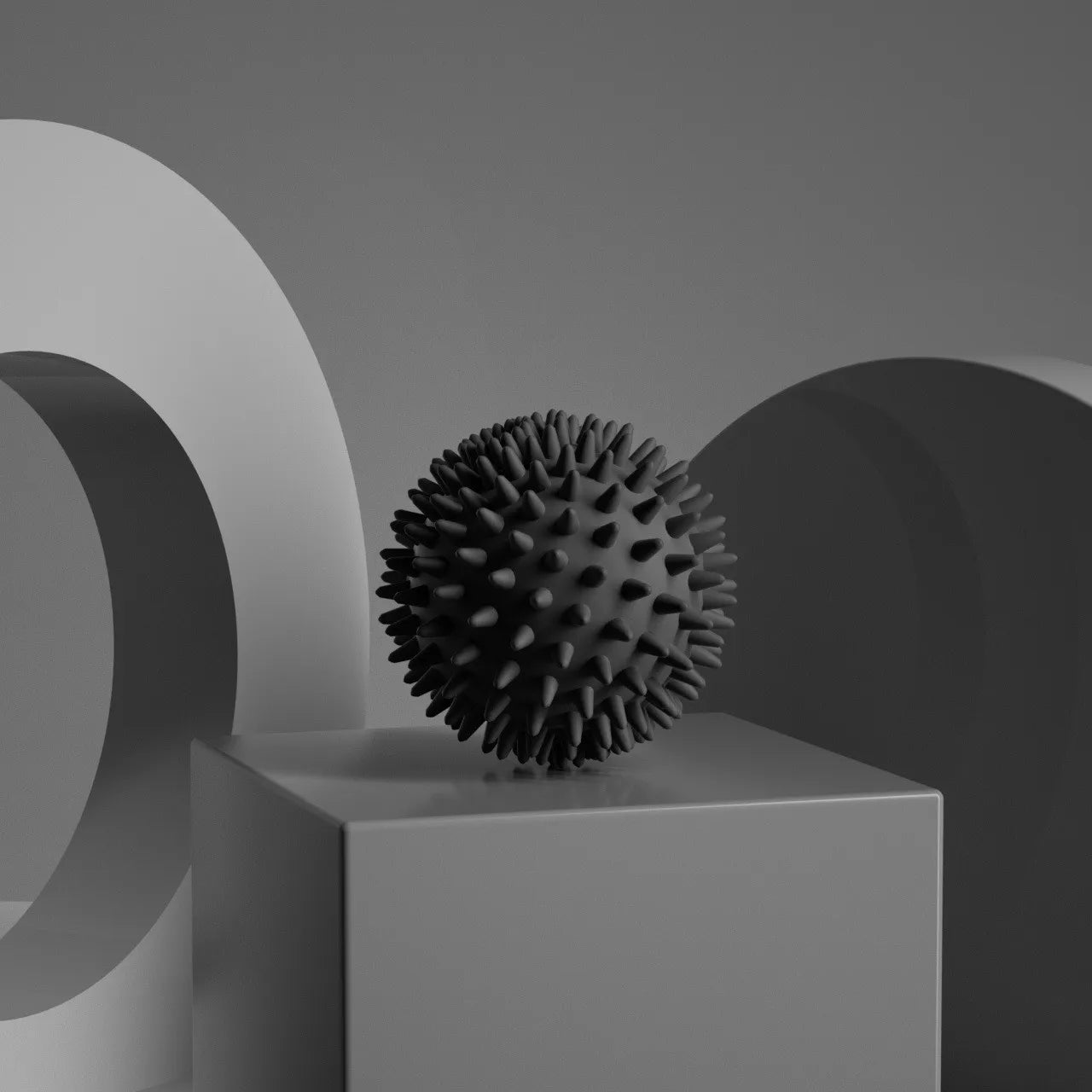 Black spiky massage ball for muscle relaxation and soothing tension
