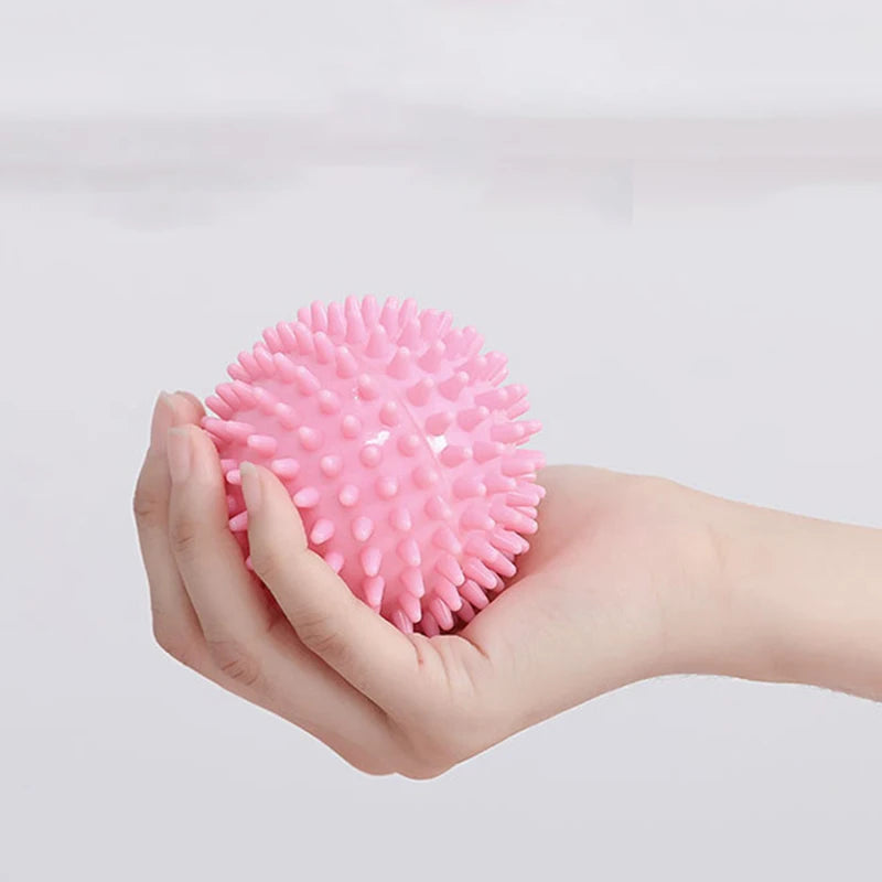 Pink spiky massage ball for muscle relaxation and tension relief